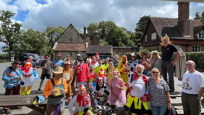 Photo taken in front of the Kentish Horse public house in Markbeech, Edenbridge. Runners and walkers dressed in fancy dress in a countryside theme.