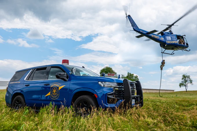 Photo of a Blue Goose and the MSP helicopter for the cruiser contest