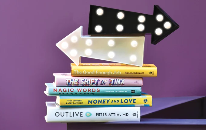 Stack of recommended books topped with arrows going in two directions.