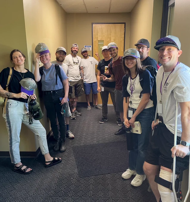 Picture of a group of Orbit Fab people wearing hats