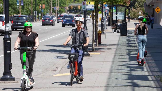 Escooter and ebike riders on multi-use pathway