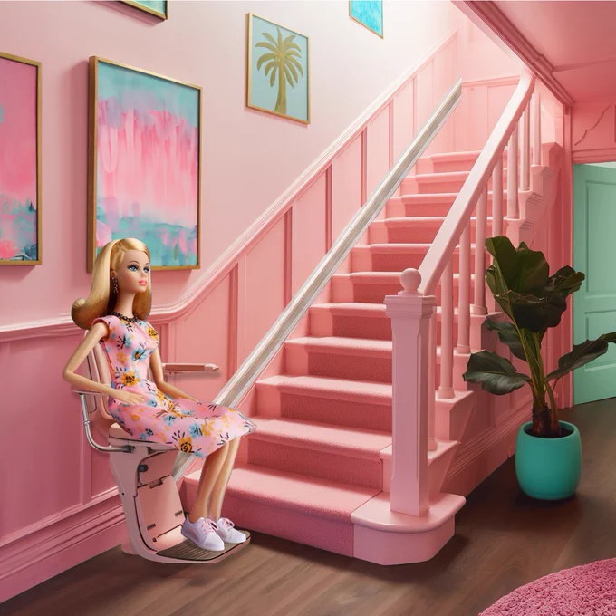 Barbie sitting on her very own Stannah stairlift! 