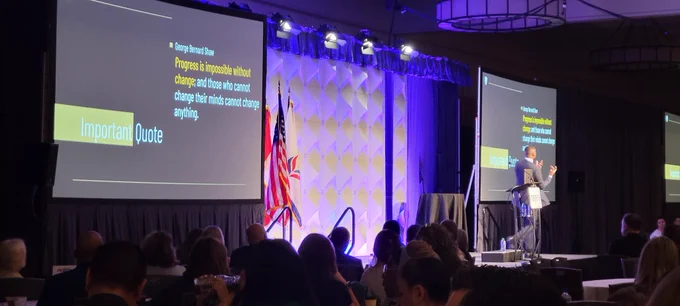 None on stage in STL, Important Quote on screen reads- 

Progress is impossible without change, and those who cannot change their minds cannot change anything.

George Bernard Shaw

