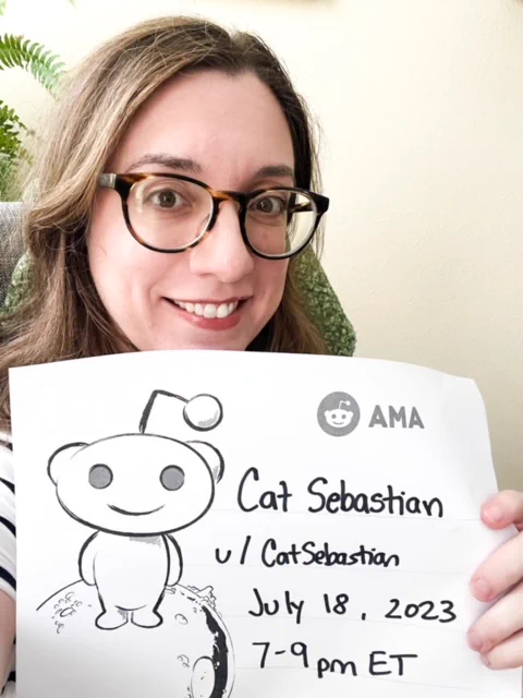 Image of Cat Sebastian holding a paper saying AMA, Cat Sebastian, u/CatSebastian, July 18 2023, 7-9pm ET