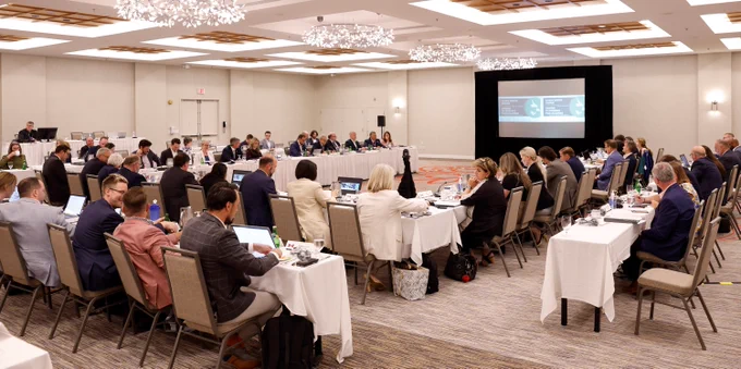 	
Wide view of conference room of the Atlantic Growth Strategy with people sitting at tables
