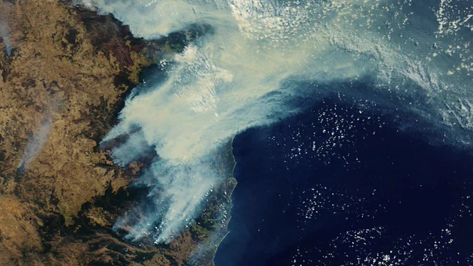 A satellite image of bushfire smoke over Eastern Australia in December 2019. Photo by European Space Agency / Flickr https://flickr.com/photos/37472264@N04/49060083887