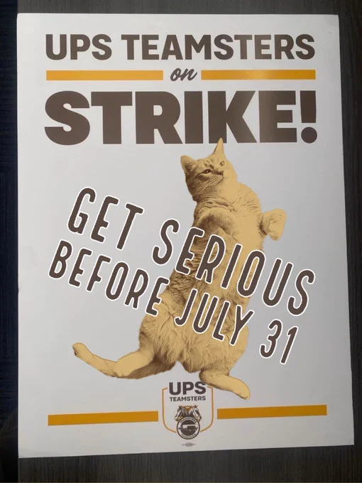 a UPS teamster strike sign that says “ups teamsters on strike! get serious before july 31” 

an orange cat is dancing with militant solidarity on the middle part of the sign