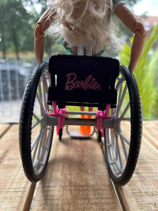 barbie’s wheelchair from the back, with barbie written on it