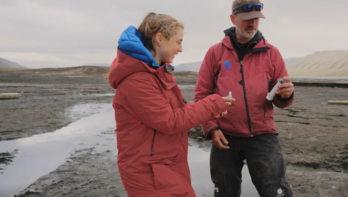 Ella pictured looking at samples whilst on a field visit as part of the documentary Lift the Ice
