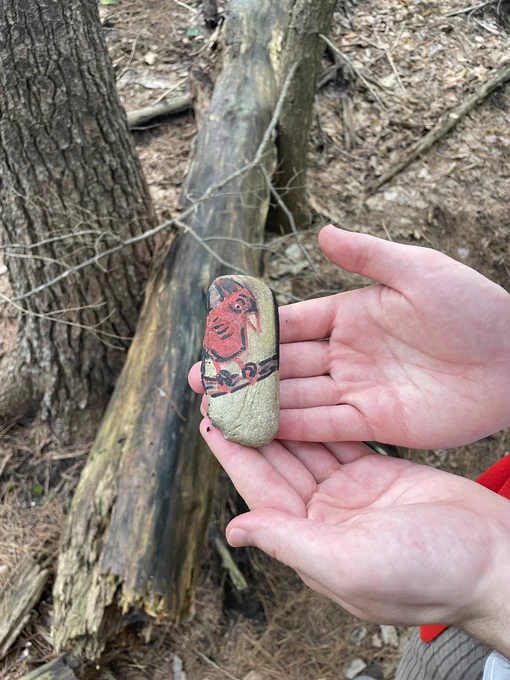 The painted rock with a cardinal on one side…