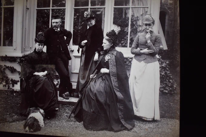 A photo of five people at Holehird Gardens near Windermere in the eighteen eighties, taken by Rupert Potter. From the left, we have Helen Potter, his wife; a male member of the Trevelyan family; an unknown woman; Lady Millais, otherwise known as Effie Gray; and a young Beatrix Potter, Rupert's daughter