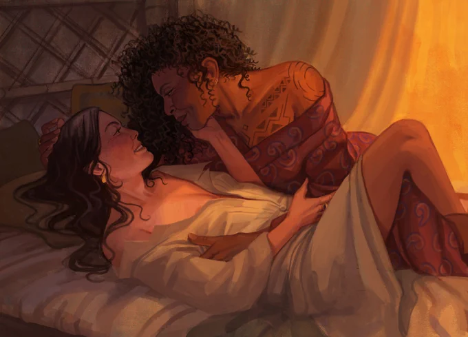 Moiraine and Siuan lie in bed within the fishing hut, curtain half-drawn behind them, letting in a soft sliver of golden sunlight. Moiraine is on her back, dark hair spilled across her pillow and shoulders, her long, white sleeping shirt parted over her chest. Siuan rests to her side, leaning over her in a cascade of curls, her red, paisley robe slipping from her tattooed shoulder. They are smiling fondly at each other. Moiraine cradles Siuan's jaw in one hand and clutches Siuan's arm with the other, which lies across her middle, holding her side. Siuan's other hand rests atop Moiraine's head. Moiraine has one bare calf hooked around the back of Siuan's knee.