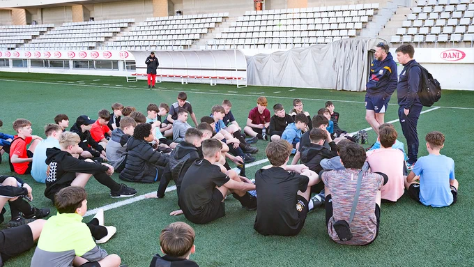 Students on a Rayburn sports tour to Barcelona listen to RCD Espanyol coaches