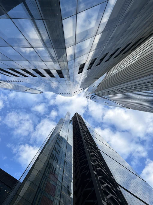 Blue sky and clouds between skyscrapers