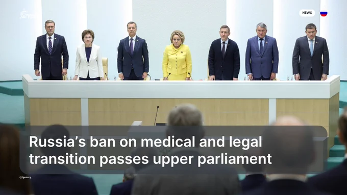 'Russia’s ban on medical and legal transition passes upper parliament' over a picture of Russia's upper parliament.