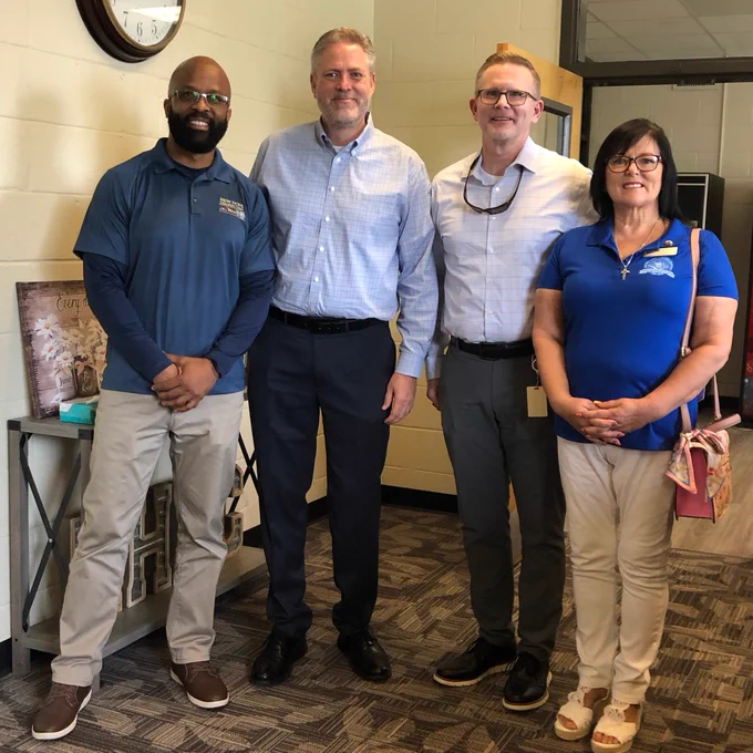 Pictured with me L-R: New Hope Education Center Director Vladimir Labossiere, Chief School Leadership Officer Jason Freeman & Board member Theresa Lyons.