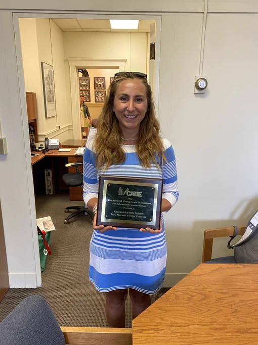 Western MS teacher Tyler Mecozzi collects her CABE Bonnie B. Carny Award of Excellence for Educational Communications.