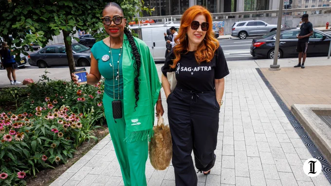 A photo of Sheryl Lee Ralph (left) and Lisa Ann Walter (right) walking into LOVE Park/