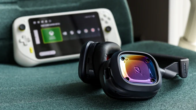 A navy Logitech G ASTRO A30 Wireless Gaming Headset and the Logitech G Cloud resting on a green chair.