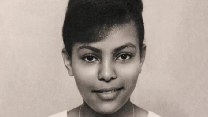 A portrait of Salamawit Dawit, 'Sally', a young Ethiopian woman with a slightly mischievous Mona Lisa smirk