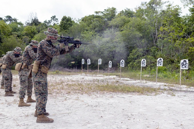 U.S. Marines with Fox Company, 2nd Battalion, 25th Marine Regiment, 4th Marine Division, Marine Forces Reserve, conducts marksmanship drills at Jungle Amphibious Training School (JATS) during Tradewinds 23 at the Jungle Area Training Site, Guyana, July 18, 2023. Tradewinds is a U.S. Southern Command-sponsored exercise designed to strengthen partnerships and interoperability, promote human rights, as well as increase all participants’ training capacity and capability to mitigate, plan for and respond to crises and security threats. (U.S. Marine Corps photo by. Cpl. Ryan Schmid)