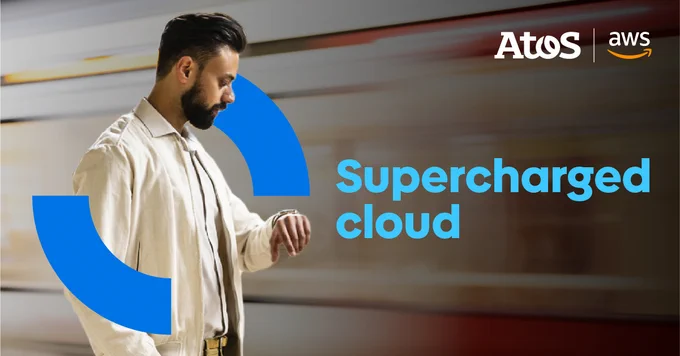 A man in suit looking at his watch, Title: Supercharged Cloud