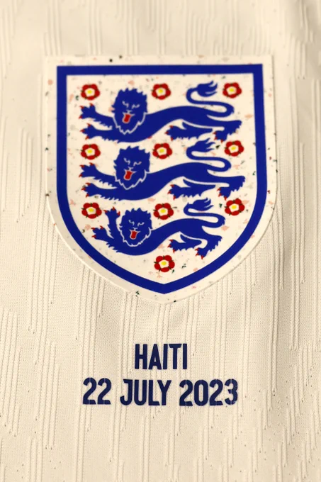 Close-up of England badge with: Haiti 22 July 2023