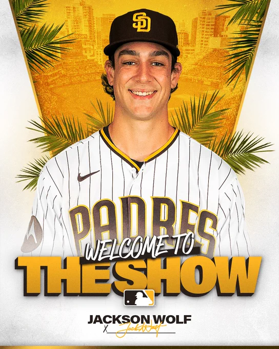 Welcome to The Show graphic featuring Jackson Wolf. There's a photo of Jackson smiling to the camera. He is wearing the Padres home white pinstripe uniform. Behind him, there are three stripes: white, gold and white. There is a gold line that separates the white and gold stripes. In the gold stripe, you can see a photo of Petco Park. There are leaves from palm trees coming out of the sides of the white stripes. White and gold text at the bottom of the graphic reads "Welcome to The Show". Jackson's name is in small brown text and his signature is in gold below that. 