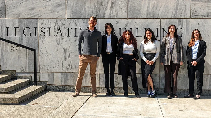 students standing in front of legislative building