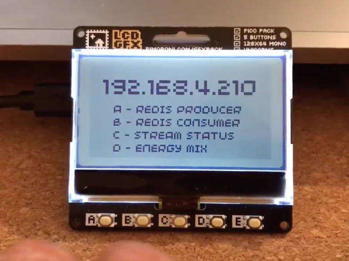 A LCD display with a Pi Pico board, connected to the internet, showing an IP and some options that can be selectable with physical buttons. 