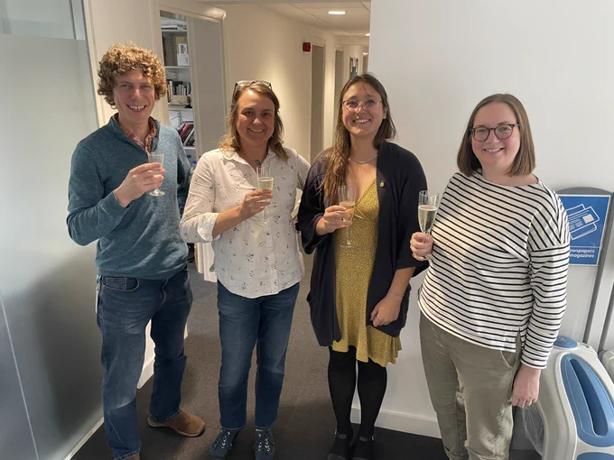 Kim celebrates with her examiners