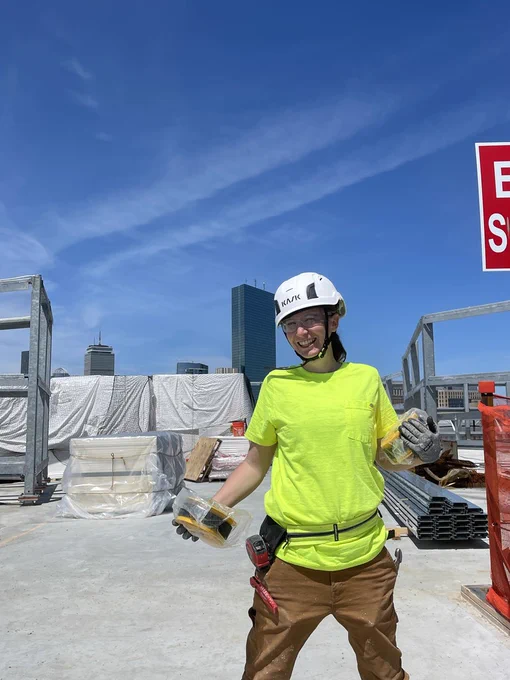 CAPTION:  Christine Greenwood, a Westford Academy graduate, works a job site in Boston through the Local 12 Union Apprenticeship Program, thanks to the training she received at Nashoba Tech’s Career Technical Institute. (COURTESY CHRISTINE GREENWOOD)