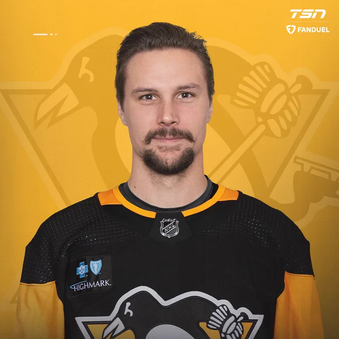 Erik Karlsson in a penguins jersey after being traded from San Jose to Pittsburgh