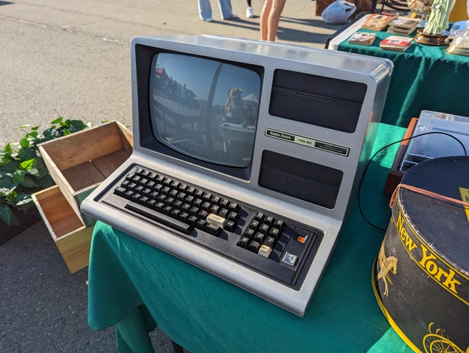 A Radio Shack TRS-80 Model III with built in monitor and no disk drives in the bays.