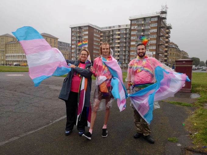 A group of people dressed in colourful outfits in the streets at Brighton Pride parade