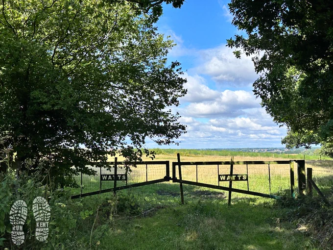 View through some farm gates over countryside in North Kent