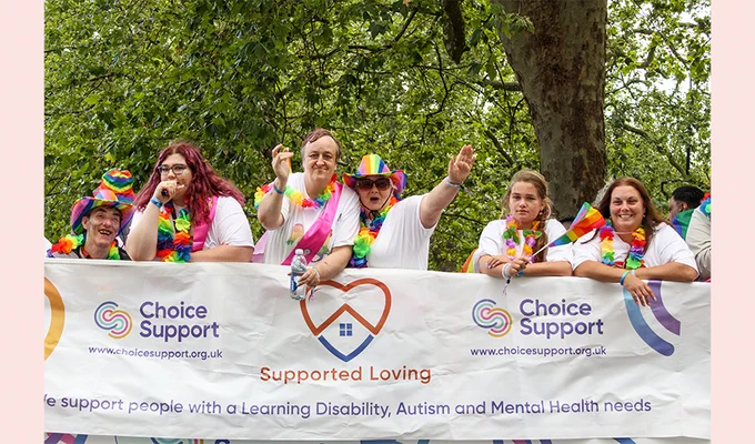People from Choice Support smiling and waving from the float at London Pride 2023
