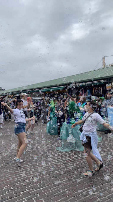 Starbucks workers, supporters and sirens dancing in the market