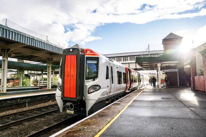 A class 197 train stopped in Llandudno Junction rail station