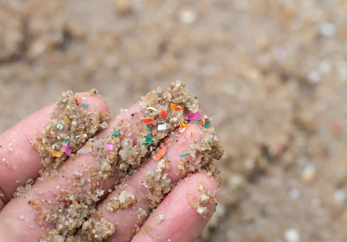 Fingers showing sand and debris on them.