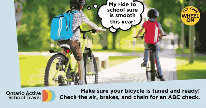 Two friends are biking to school together. One is thinking “My ride to school sure is smooth this year!”. Text reads “Make sure your bicycle is tuned and ready! Check the air, brakes, and chain for an ABC check.” 