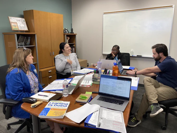 Members of the Satellite Center’s Guiding Coalition meeting to plan for the upcoming school year.