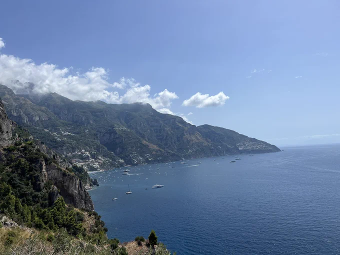 Amalfi Coastline, a bay with boats against the cliff side