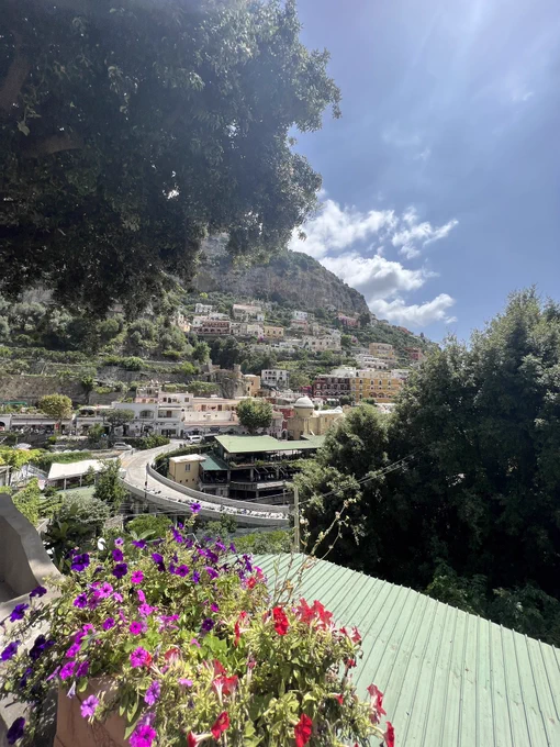 Postiano. Winding road in the village with buildings going up the side of the hill
