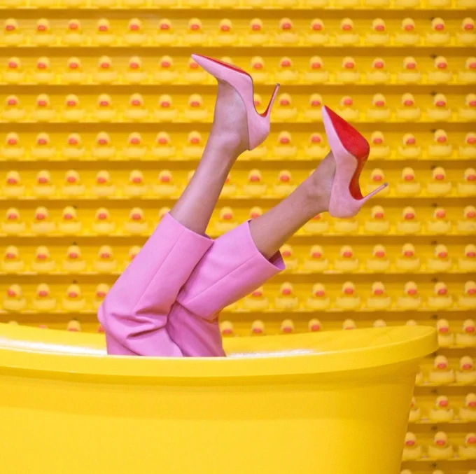 Person in nice clothing sitting in a bathtub. Dry cleaning is like a spa day for your clothes. 