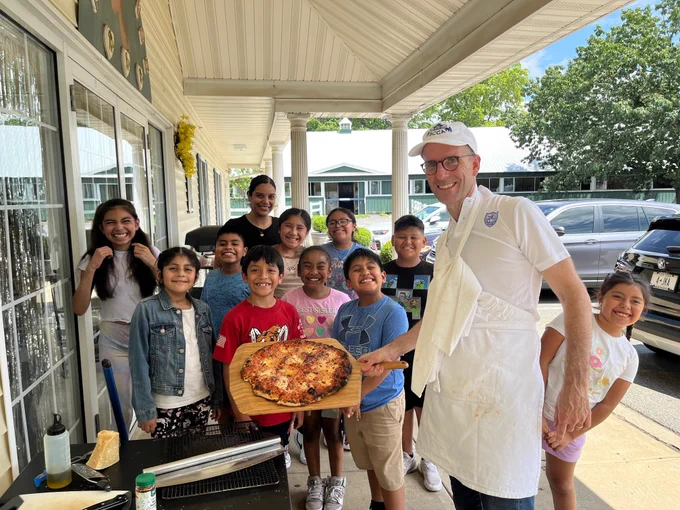 Ken, a pizza, and a gaggle of BCCA kids (and one teacher).