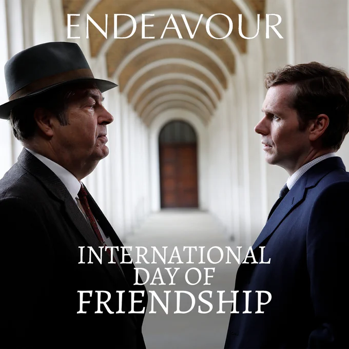 Endeavour Morse and Fred Thursday stand facing each other with a knowing look. 

The text reads International Day of Friendship