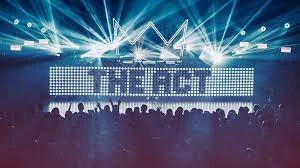 A stadium with jumping crowd members in shadow at the front with bright blue lights and the words "The Act" in shadow on a lit up lightboard.