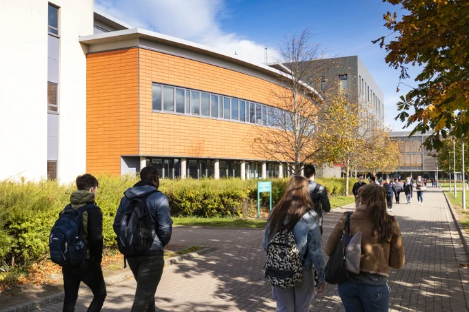 north campus exterior with students walking