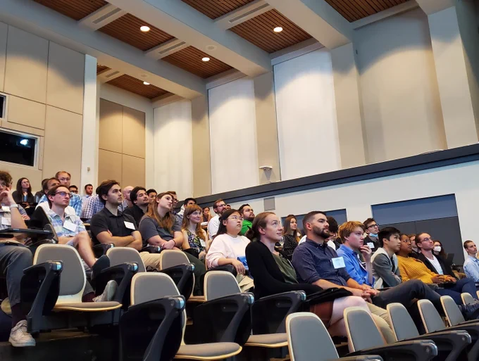 Lecture hall with researchers interested in electrochemistry listening to a scientific presentation.